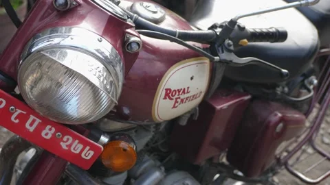 Nepal. Slow motion pan high angle shot of red Royal Enfield Classic 500  Stock Footage 140196697