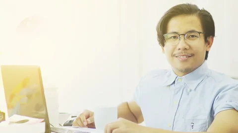Nerd Asian Man Smiles to The Camera - Slow Motion Stock Footage 60617108