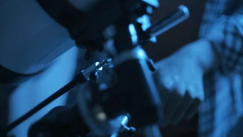 Nerd boy looking through a telescope and exploring constellations Stock Footage 128500879