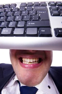 Nerd businessman with computer keyboard on white Stock Photos