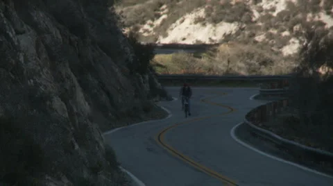 Nerd cyclist downhill Stock Footage 1065904