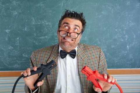 Nerd electronics technician retro battery clamps Stock Photos