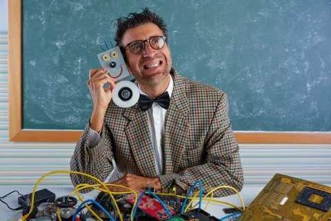 Nerd electronics technician silly hug a robot Stock Photos