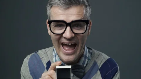 Nerd guy giving an engagement ring to his girlfriend Video stock 90640988