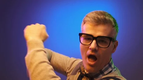 Nerd guy with glasses dancing and having fun Video stock 90642635