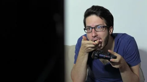 Nerd guy plays with videogame Video stock 63077174