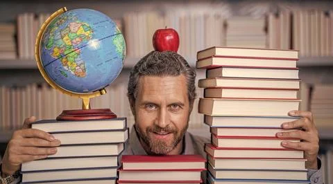 Nerd man in classroom. bookworm in school library. education and knowledge. man Stock Photos