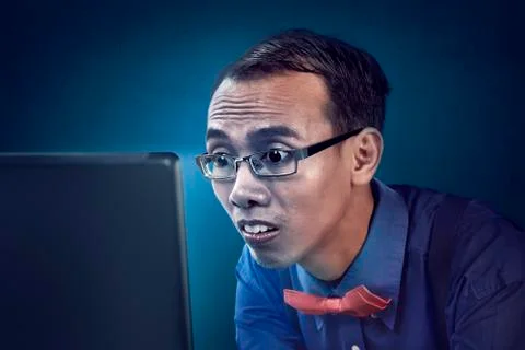 Nerd man concentration using laptop Stock Photos
