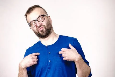 Nerd man in eyeglasses thinking and pointing Stock Photos
