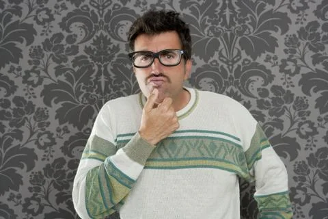 Nerd pensive silly man retro wallpaper glasses tacky Stock Photos