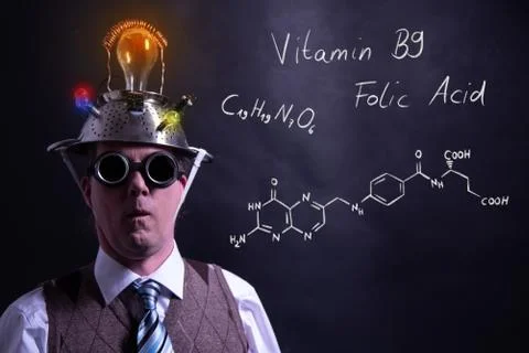 Nerd presenting handdrawn chemical formula of Vitamin B9 Stock Photos