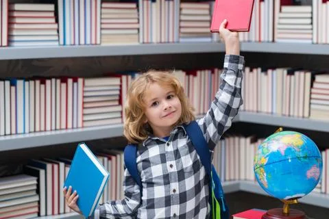 Nerd pupil. Clever child from elementary school with book. Smart genius Stock Photos