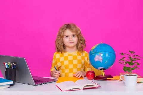 Nerd school kid isolated on studio background. Clever child from elementary Stock Photos