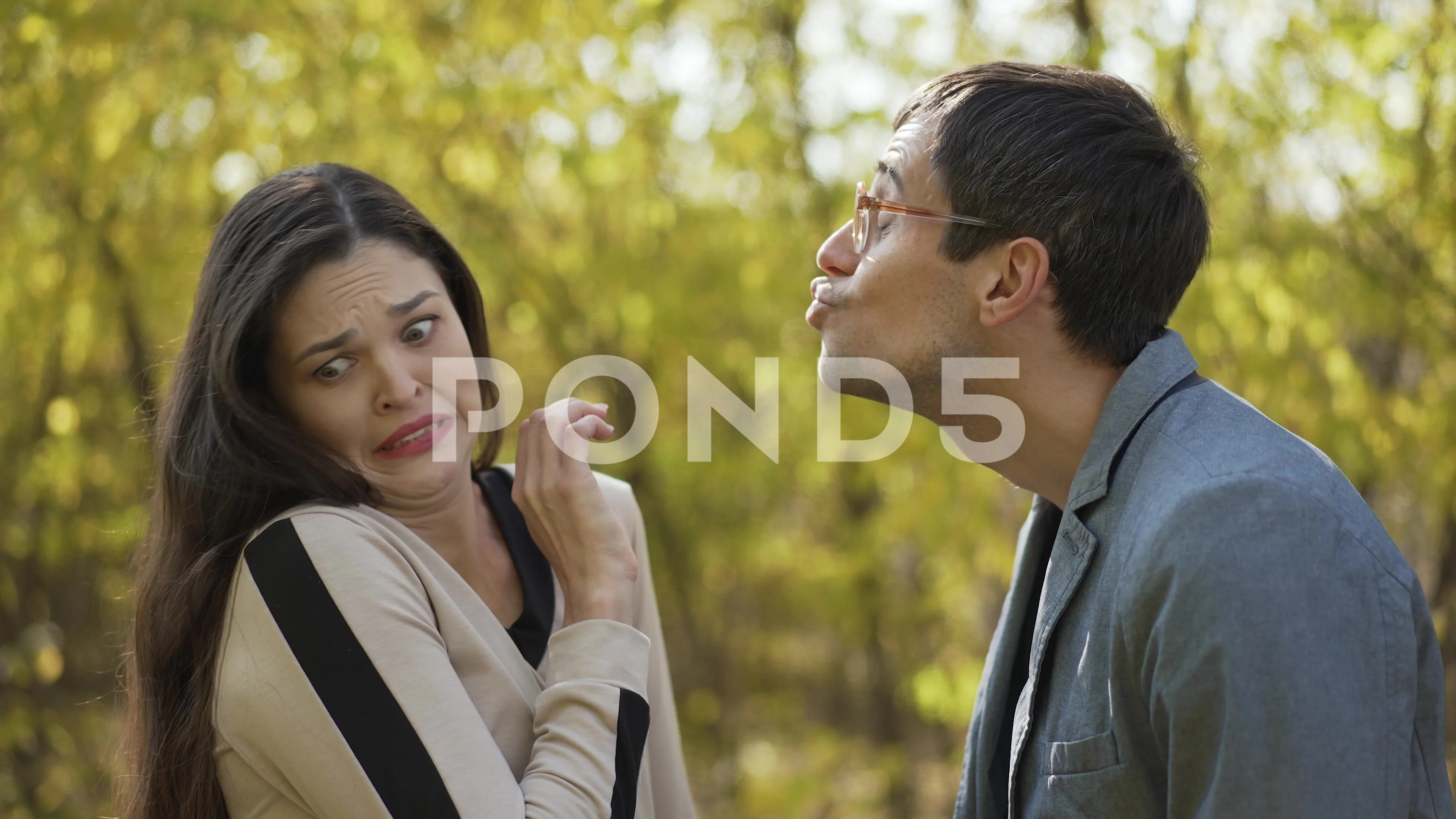 Nerd trying to kiss a woman