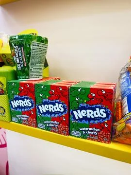 Nerds candy boxes watermelon and cherry on bright store shelf display with .. Stock Photos
