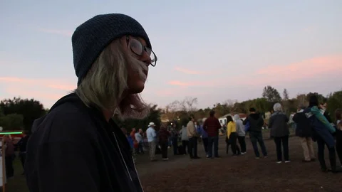 Nerdy girl alone in crowd Stock Footage 122356079