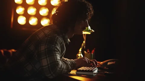 Nerdy guy troubleshooting program bugs on retro computer, 90s work lifestyle Stock Footage 321072539