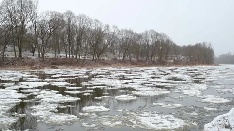Neris river covered with pancake ice. Winter city landscape. Vilnius, Lithuania. Stockbeeldmateriaal 304089448