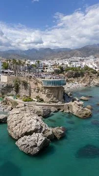 Nerja Spain Coastal Cliffs Turquoise Mediterranean Sea And Mountains 库存照片