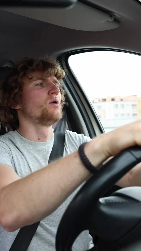 Nervous driver struggles to control the car in changing urban traffic Stock Footage 342919556
