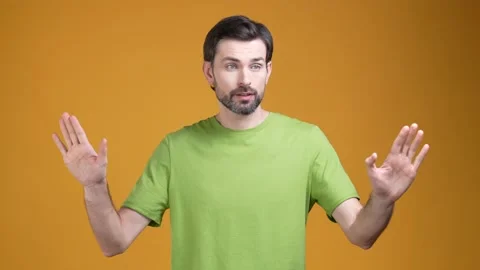 Nervous guy asking you stop isolated shine color background Stock Footage 204988457