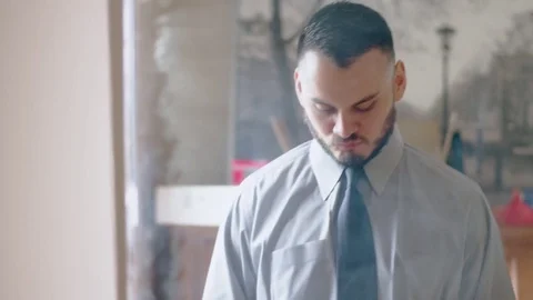 Nervous hispanic man practicing handshake in front of mirror Stock Footage 84486854