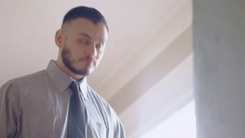 Nervous hispanic man practicing introduction in front of mirror Stock Footage 84487281