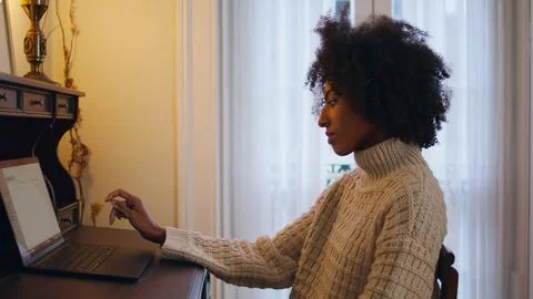 Nervous lady looking computer screen home closeup. African girl waiting answer Stock Photos