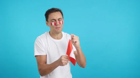 Nervous man cheering for Peru during a match looking away Stock Footage 274439876
