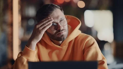 Nervous Man Looking At Display Of Laptop And Thinking About Investment And Stock Footage 343669272