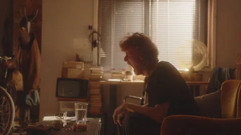 Nervous Man Sitting on Couch, Screaming in Distress and Crying Emotionally Video stock 297924258