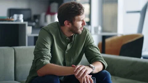 Nervous man is waiting mobile call or message, looking at smartphone in hands Stock Footage 208346530