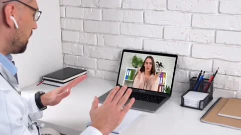 Nervous panic attack woman in computer screen talk online with medical worker Stock Footage 143005564