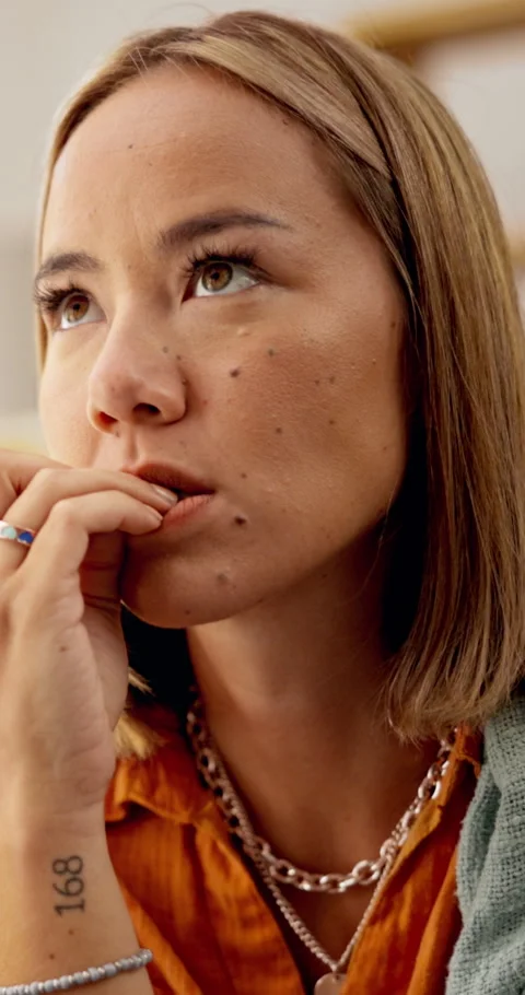 Nervous, thinking and biting nails with woman in home for trauma, anxiety or Stock Footage 333232404