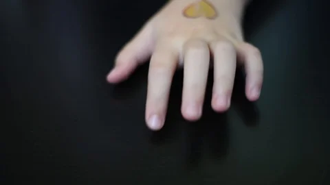 The nervous TIC of the child is expressed by beating the fingers on the table Stock Footage 95433396