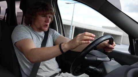 Nervous young driver feels stressed while taking a driving test Stock Footage 343720032