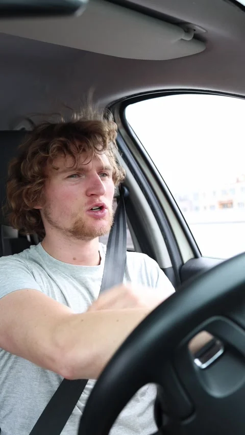 Nervous young driver loses his temper after another car cuts him off Stock Footage 342922100