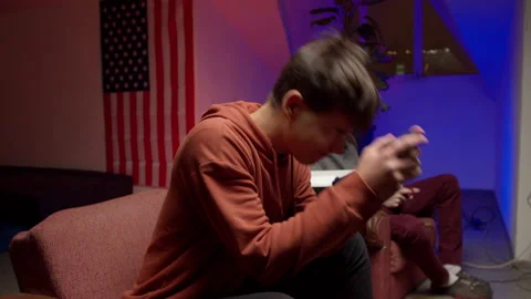 Nervous young man with gamepad playing videogame Stock Footage 147399321