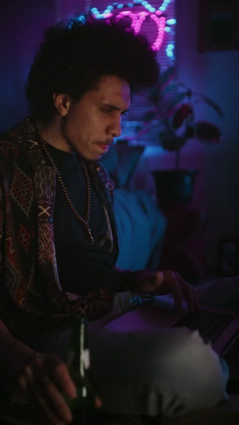 Nervous Young Programmer Coding on Laptop and Drinking Beer Stock Footage 290862977