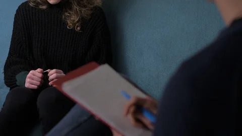 Nervous,anxious woman's hands during session by the psychologist Stock Footage 103532952