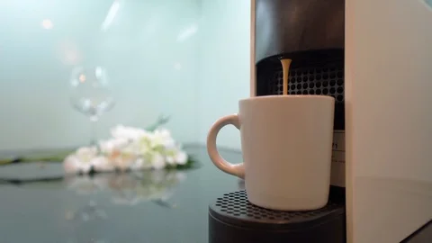 Nespresso Coffee Maker Machine in the kitchen interior. Fresh Espresso Coffee Stock Footage 125963516