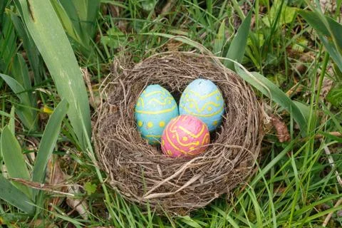 Nest with chocolate eggs for Easter Stock Photos