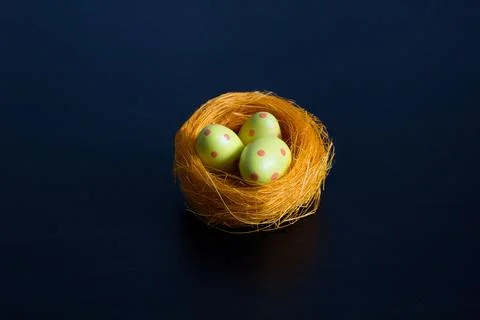 Nest with Easter eggs in specks. Stock Photos