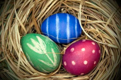 Nest of natural-colored Easter eggs Stock Photos
