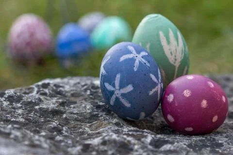 Nest of natural-colored Easter eggs Stock Photos