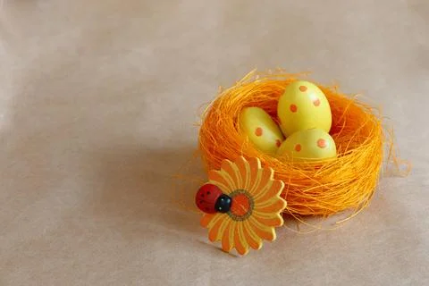 Nest with speckled Easter eggs on a crafting Stock Photos