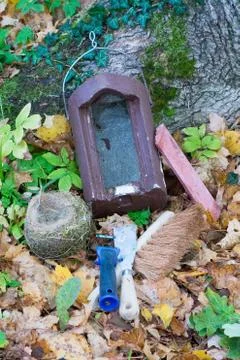 Nesting box, nest (blue tit) and tools for nesting box cleaning on forest flo Stock Photos