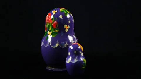 Nesting dolls on a black background Video stock 115182862