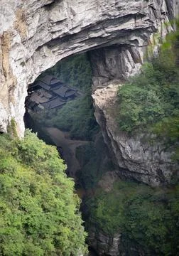 Nestled deep within a colossal limestone gorge of the Wulong Karst in Chong.. 写真素材