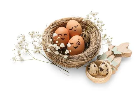 Nests with creative Easter eggs, flowers and wooden rabbit isolated on white  Stock Photos